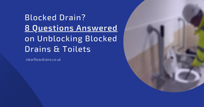 Blocked drain warning sign near a drain